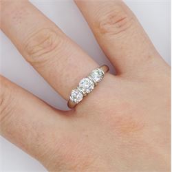 Platinum three stone round brilliant cut diamond ring by FEU, London 2003, total diamond weight 1.03 carat