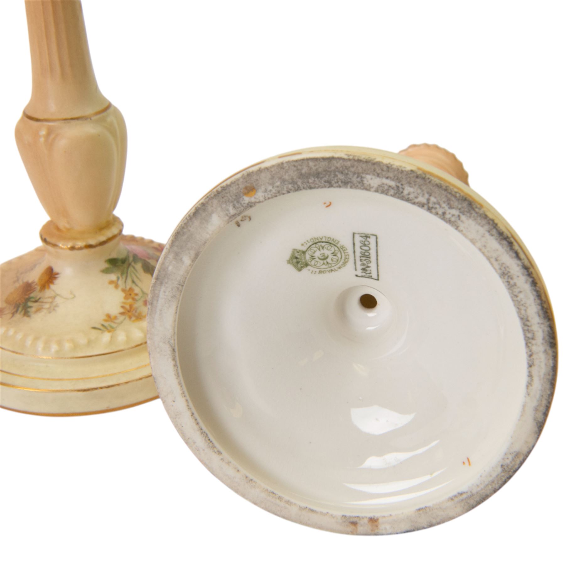 Royal Worcester blush ivory dressing table set, decorated with flowers, comprising an oval tray, three covered pots and a pair of candlesticks 