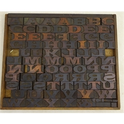 Set of 1930's/40's alphabet wooden printing blocks, A-Z with some punctuation blocks, housed in rectangular wooden tray, 49cm x 41cm   