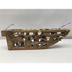 Two carved oriental wall hangings, the first example gilded depicting a temple and garden scene, the second figures in a garden, L49cm