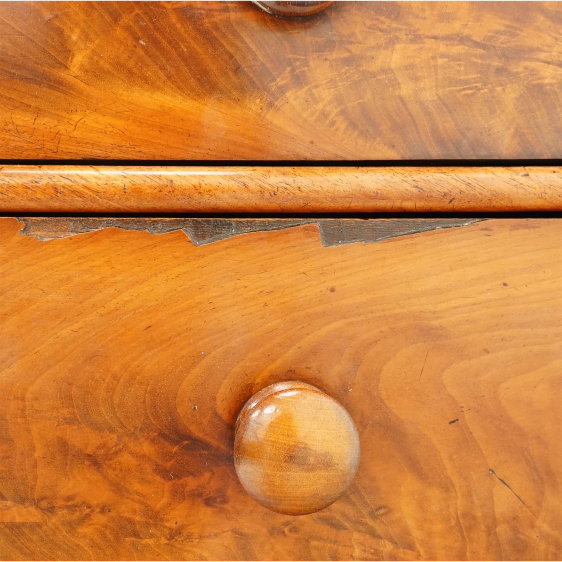 Mid-Victorian figured mahogany chest of drawers, circa 1860, rectangular moulded top over two short and three long drawers with figured veneers, on turned supports