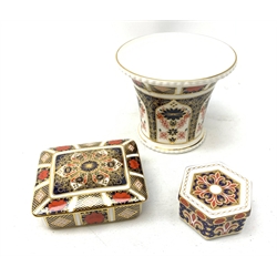 A Royal Crown Derby Imari 1128 vase, H12cm, together with a Royal Crown Derby Imari 1128 box and cover, L11cm, and a Royal Crown Derby 1297 hexagonal box and cover, 7.5cm, each with marks beneath. 