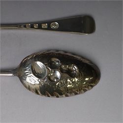 Mid 20th century silver berry spoons, each with gilt bowls embossed with fruit, with Queen Elizabeth II Coronation hallmark for C J Vander Ltd, London 1952, L22cmcm