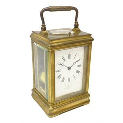  Late 19th century brass carriage clock, corniche case with white enamel Roman dial inscribed 'Payne & Co. Paris, 163 New Bond Street London' twin train movement with visible escapement stamped 9575, striking the hours on a coil, with push repeat, H18cm in original case with key  