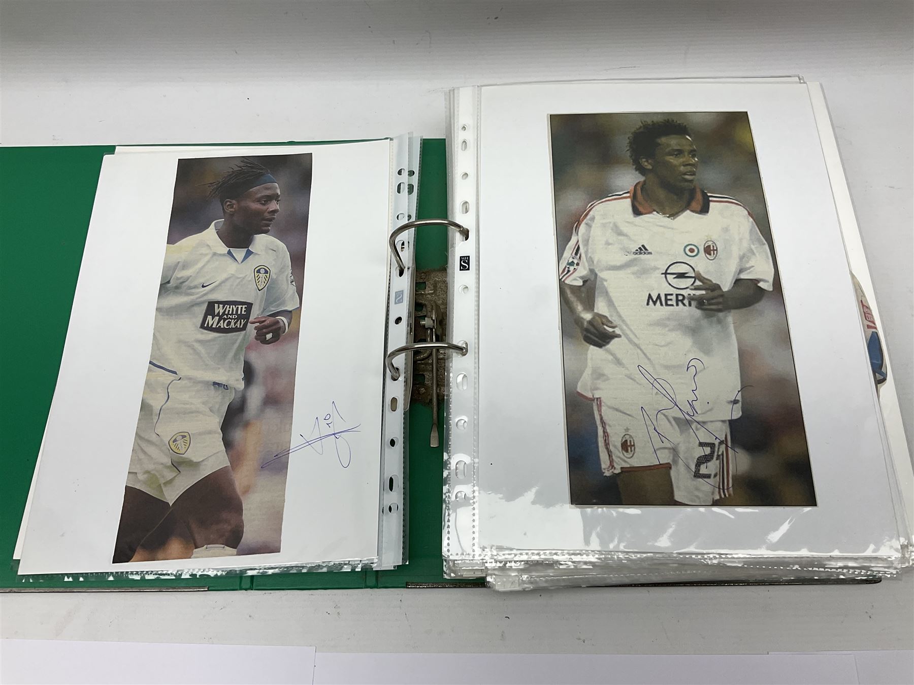 Collection of approximately 200 Leeds United related autographs, predominantly signed newspaper cuttings, contained within ring binder, together with a number of loose examples