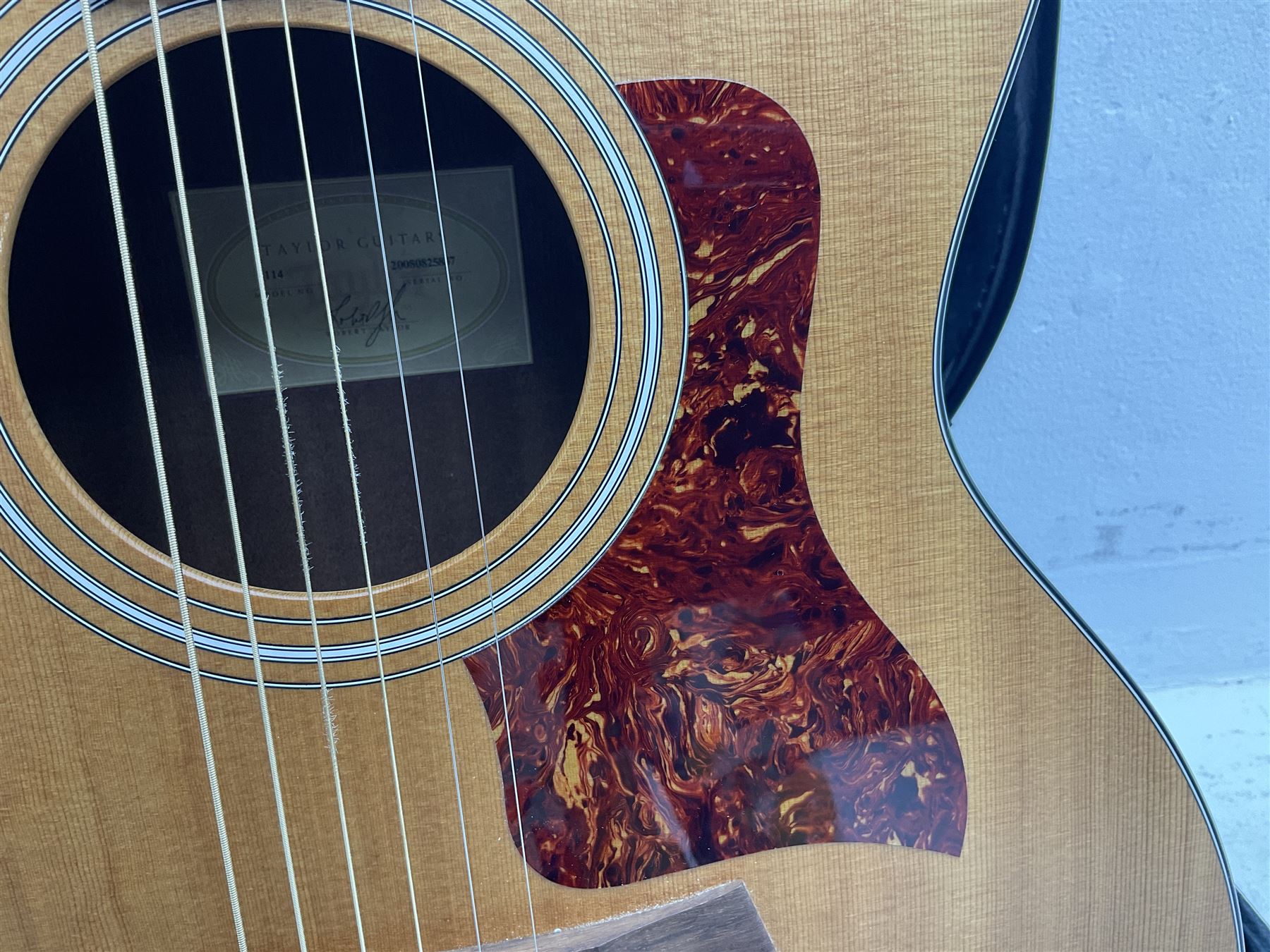 2008 Taylor Model 114 acoustic guitar with mahogany back and ribs and spruce top, serial no.20080825837, L104.5cm; in Taylor hard carrying case with paperwork
