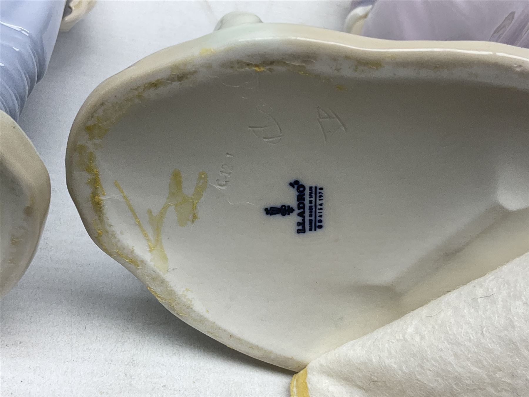 Four Lladro figures, comprising Pulling Dolls Carriage no 5044, Belinda with her Doll no 5045, Pretty Pickings no 5222 and Shepherdess with basket no 4678 