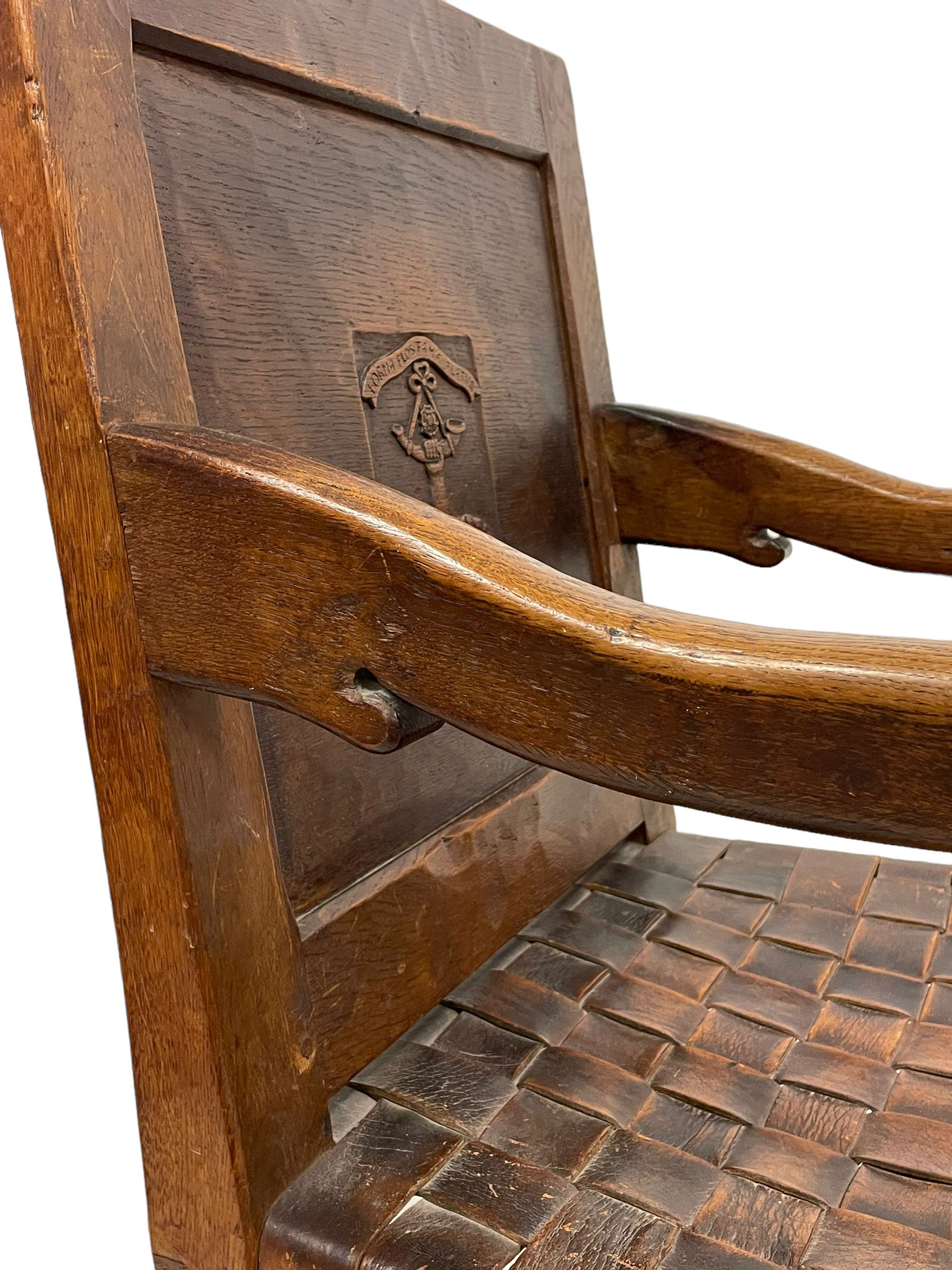 Mouseman - circa. 1930s set of six (4+2) oak dining chairs, panelled back carved with the Bagshawe family crest, the moto 'Forma Flos Fama Flatus' over an arm grasping a bugle-horn with ribbon tie and Yorkshire rose motif, adzed frame, leather lattice strap seat, on octagonal supports united by stretchers, two carvers and four side chairs, each carved with mouse signature, by Robert Thompson of Kilburn 

Provenance: Owned since manufacture by the Bagshawe family, descendants of the Staithes Group Artist Joseph Richard Bagshawe RBA (1870-1909).