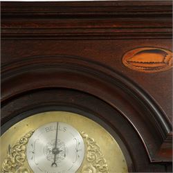 Lister of Halifax -  Oak cased musical longcase clock c1790, 8-day movement sounding the quarters and hours on bells or gong rods, case with a flat pediment and oval  conch inlay beneath, break arch hood door with reeded pilasters and brass Corinthian capitals, trunk with conforming quarter recessed pillars and a long wavy topped door, plinth with a raised panel and applied moulding the the base, break arch brass dial with cast spandrels and engraved dial centre, with a silvered chapter, seconds dial and cartouche with makers name, gongs or bells selector to the arch, chapter with Roman numerals, five minute Arabic's, minute track and steel moon hands, dial pinned directly to a three train weight driven movement with a nest of eight bells and eight gong rods, sounding the hours on either bells or gong rods, with a rack strike and recoil anchor escapement. With pendulum and weights.
The Lister family were a prodigious family of prolific clockmakers working in Halifax and the West Riding area of Yorkshire during the 18th and 19th century, well-known and noted for producing a number of chiming and musical longcase clocks.