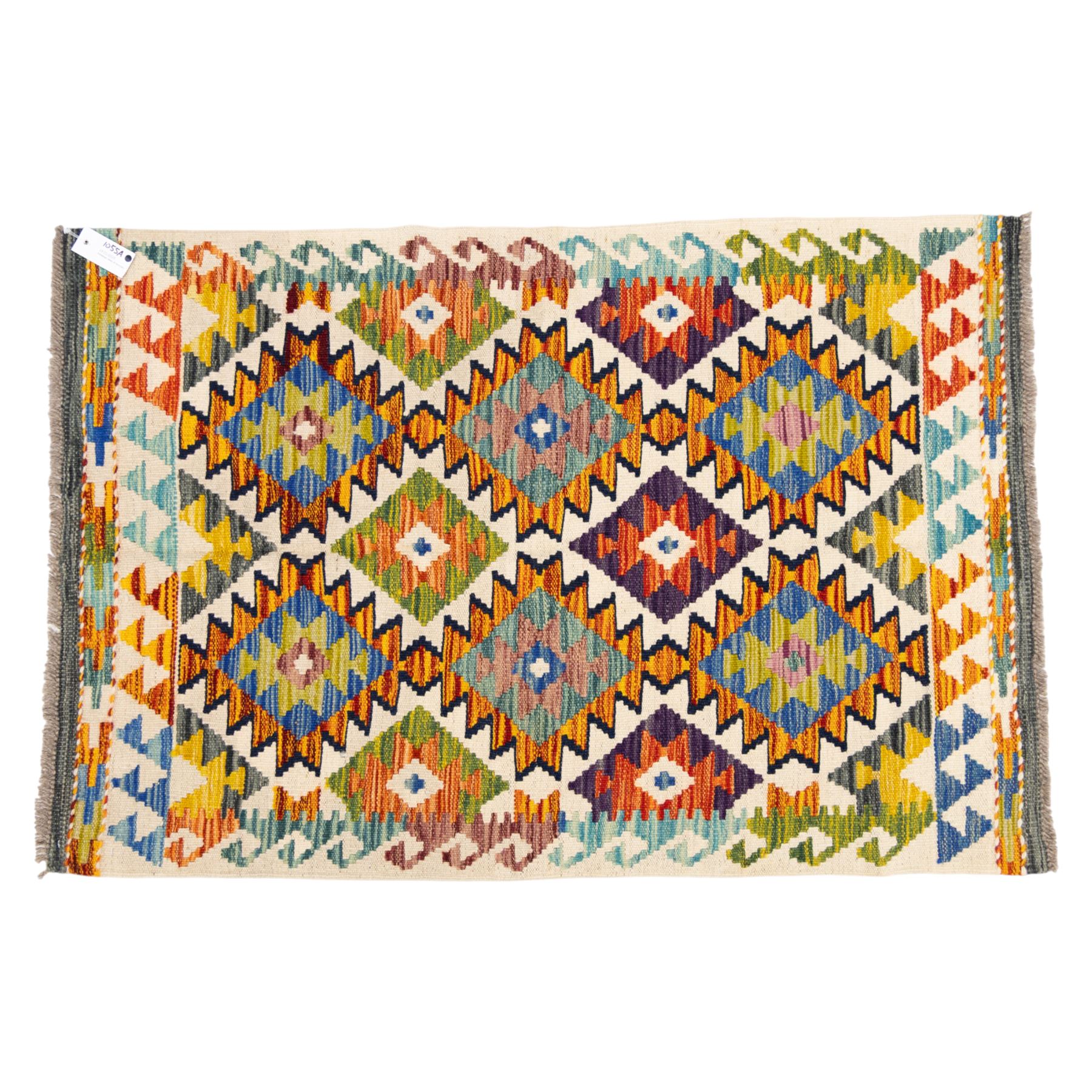 Two Chobi flatweave kilims with a repeating stepped diamond medallion design in live green, rust, teal, purple, and ivory, framed by chevron and geometric borders, 121x80cm & 87x60cm 