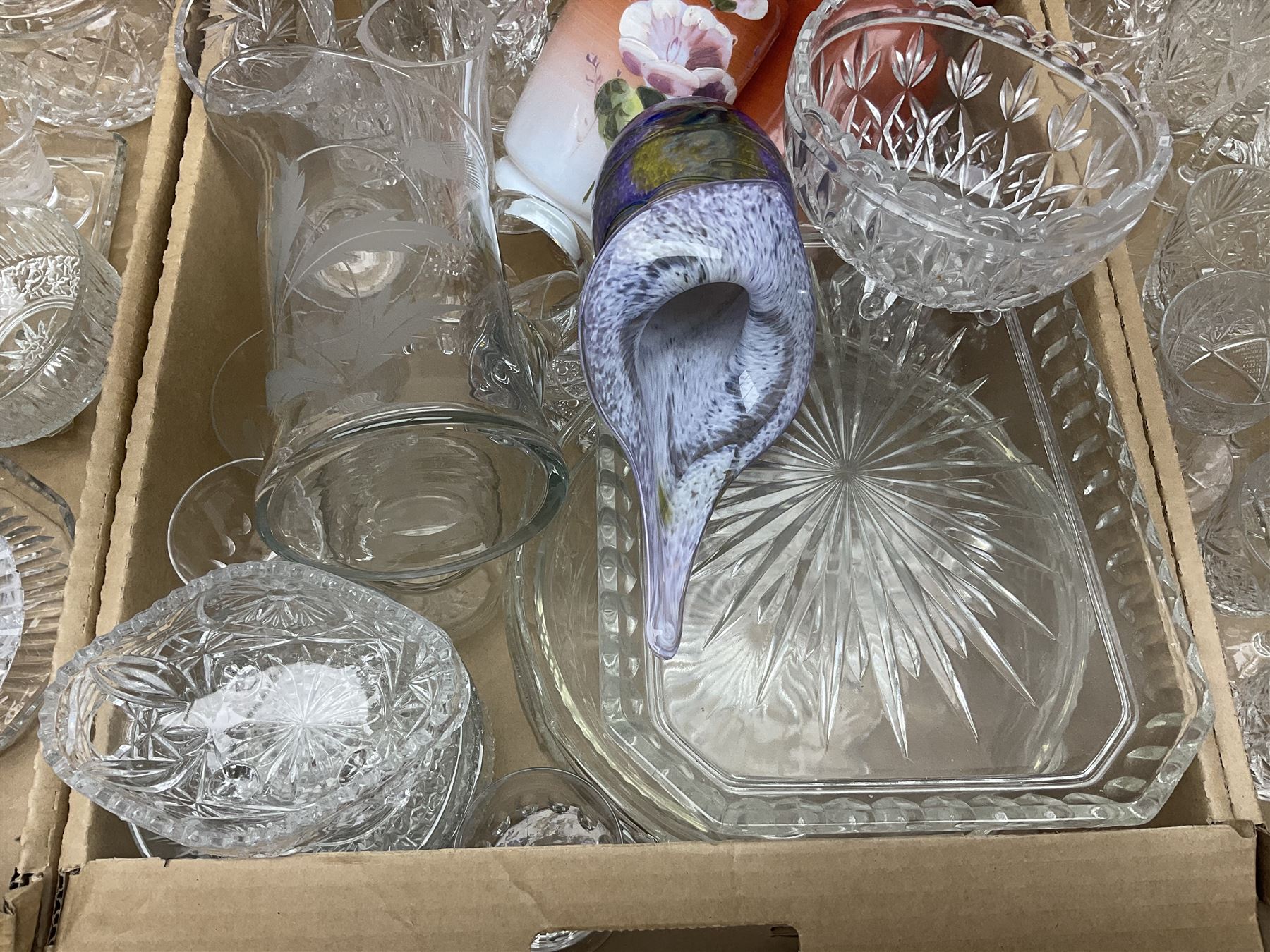 Four boxes of glassware to include painted vases, jugs, drinking glasses, art glass vase etc