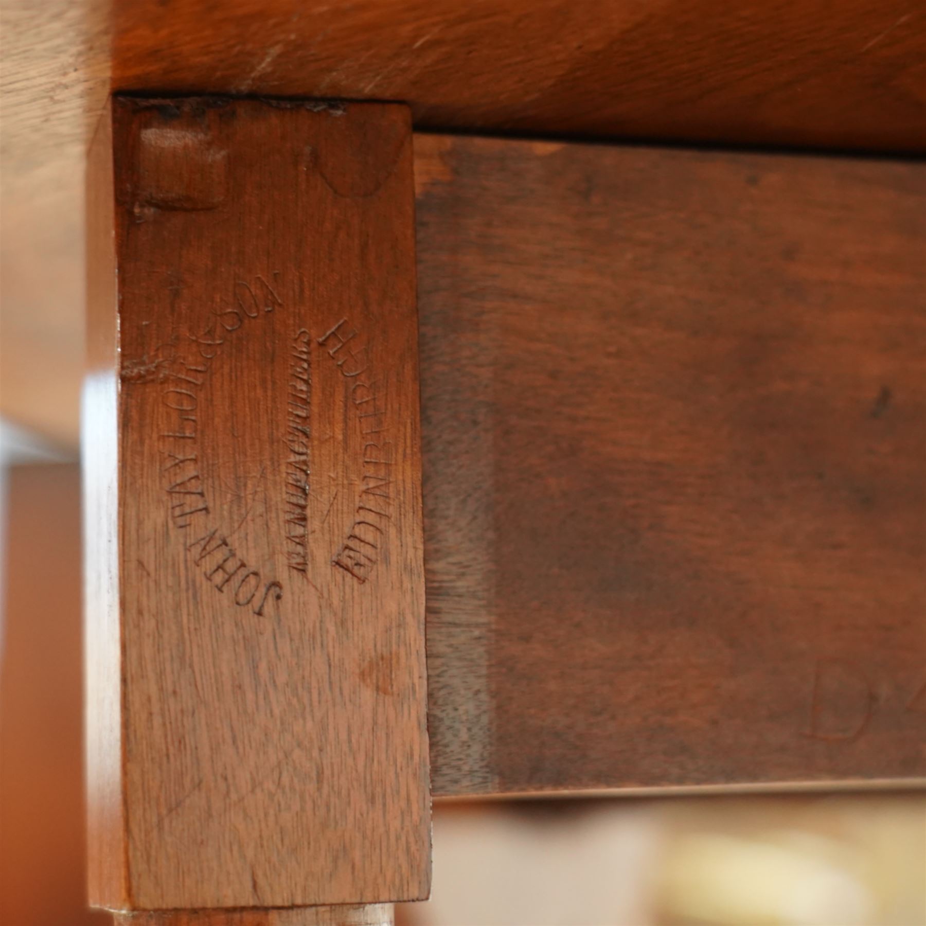 John Taylor & Son, Edinburgh - Late Victorian Aesthetic style walnut Sutherland table, with a hinged oval top on fret carved support, stamped John Taylor & Son Edinburgh, supported by scrolled feet on ceramic castor (Extended 105cm)