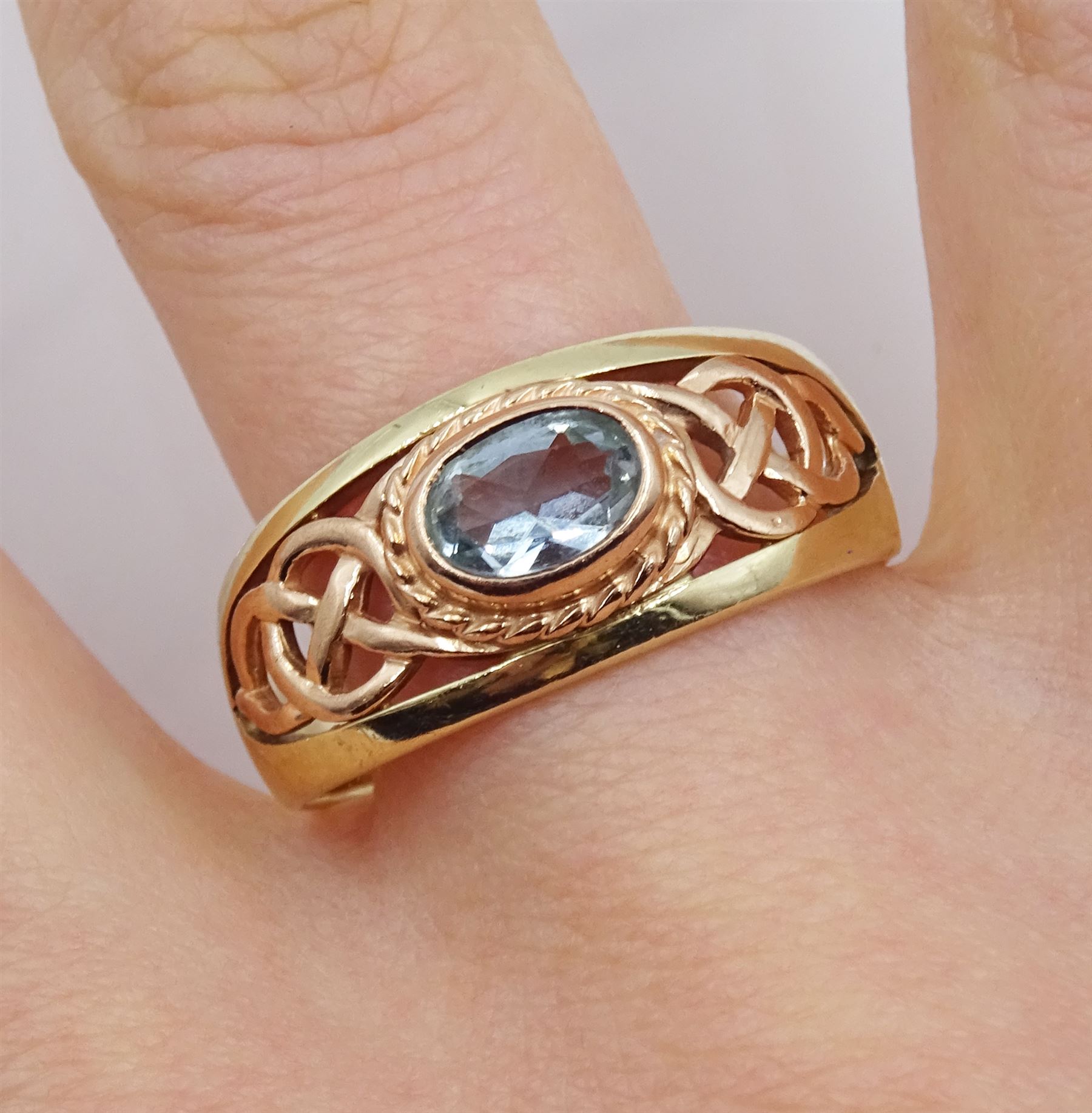 Clogau 9ct yellow and rose gold Celtic design single stone oval aquamarine ring, hallmarked, in original box 