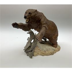 Three Franklin Mint figures, first example On The Prowl, on wooden stand H32cm, L63.5cm, Grizzly, H23cm and American Majesty by Ronald Van Ruyckevelt H37cm, together with a group of five other figures.  