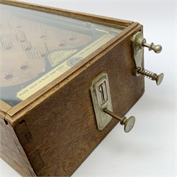 Early 20th century table top bagatelle game 'The Advance Pin Table - British Made - For Amusement Only',  in oak case with glazed top and coin operated mechanism with quantity of pre-decimal pennies 30 x 64cm