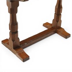 Mouseman - oak side table, rectangular adzed top, raised on octagonal supports united by stretcher on sled feet, with carved mouse signature, by the workshop of Robert Thompson of Kilburn