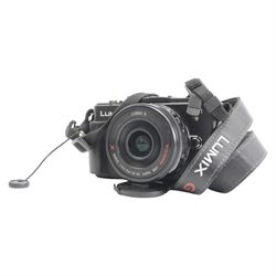 Panasonic Lumix DMC-GX1 digital camera serial no. FT2DA801057 with a Lumix G Vario 1:3.5 - 5.6/14-42 ASPH lens, with charger