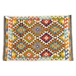 Two Chobi flatweave kilims with a repeating stepped diamond medallion design in live green, rust, teal, purple, and ivory, framed by chevron and geometric borders, 121x80cm & 87x60cm 