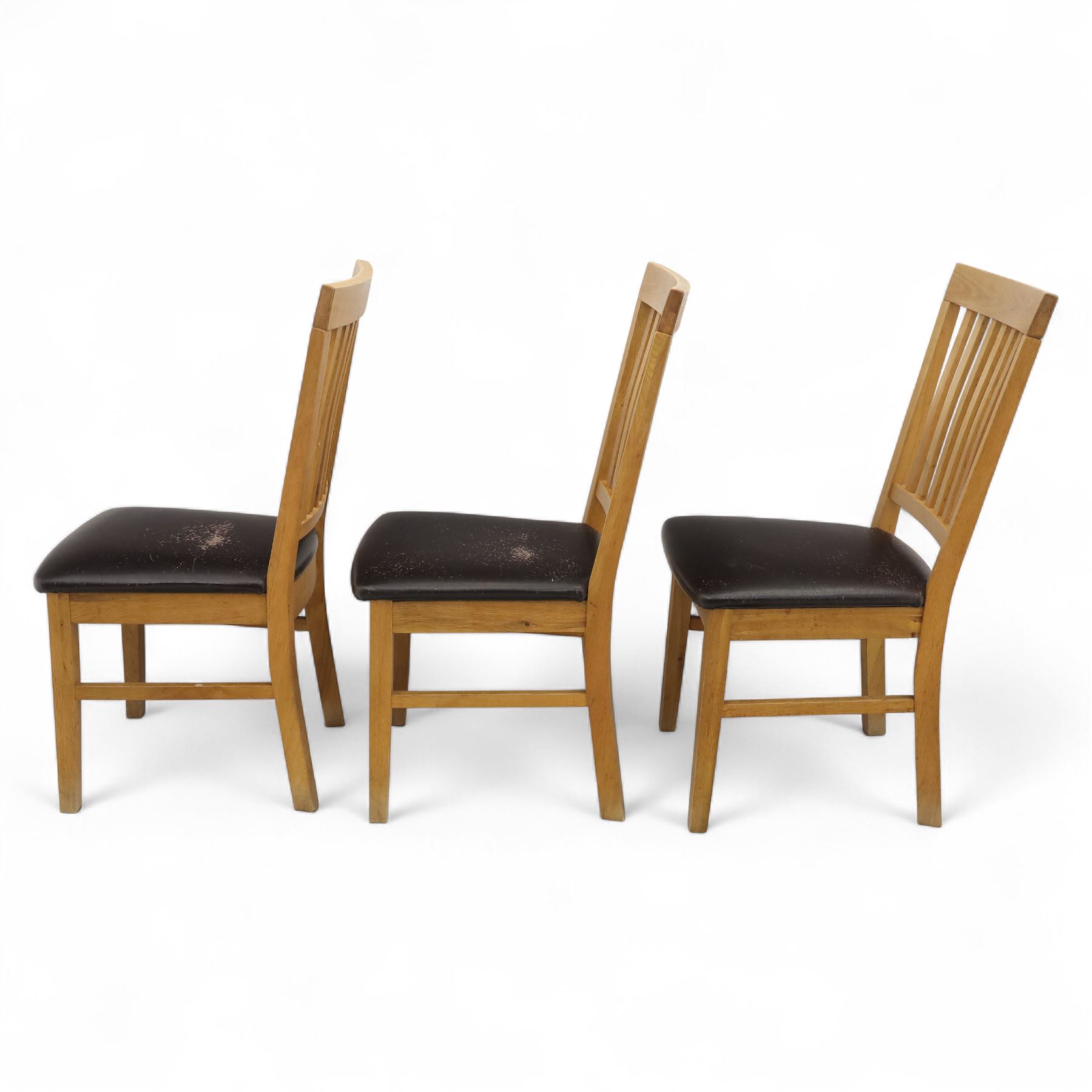 Contemporary set of six light oak dining chairs with faux leather cushion seats 