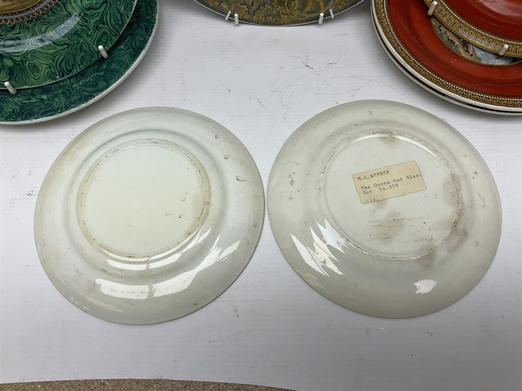 19th century Prattware table ware to include an oval footed dish decorated with a scene after Landseer 'Highland Music', retailed by James Muggleton L27.5cm, ‘The Truant’ plate after T. Webster, 'Blind Man's Buff' & 'Snap Dragon' tea plate, two side plates with malachite printed borders and others (17)