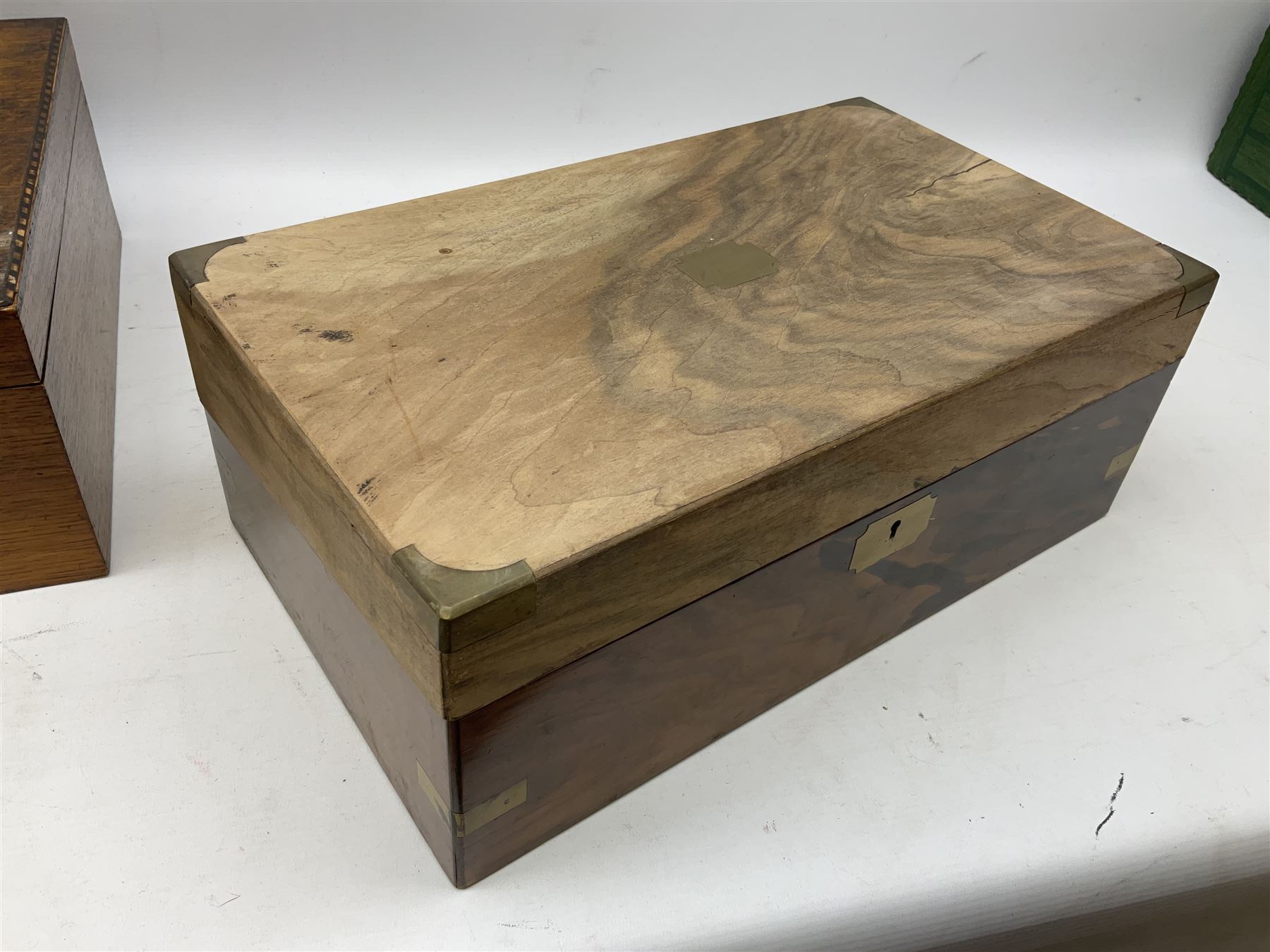 Early 20th century oak canteen box, the hinged lid decorated with marquetry banding and brass shield shaped plaque lifting to reveal red lined interior with lift out tray,  together with a walnut writing slope for restoration, largest L41cm, H44.5cm D33cm