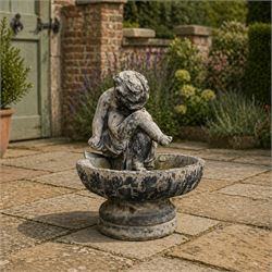 19th century lead bird bath depicting a seated cherub on a shell