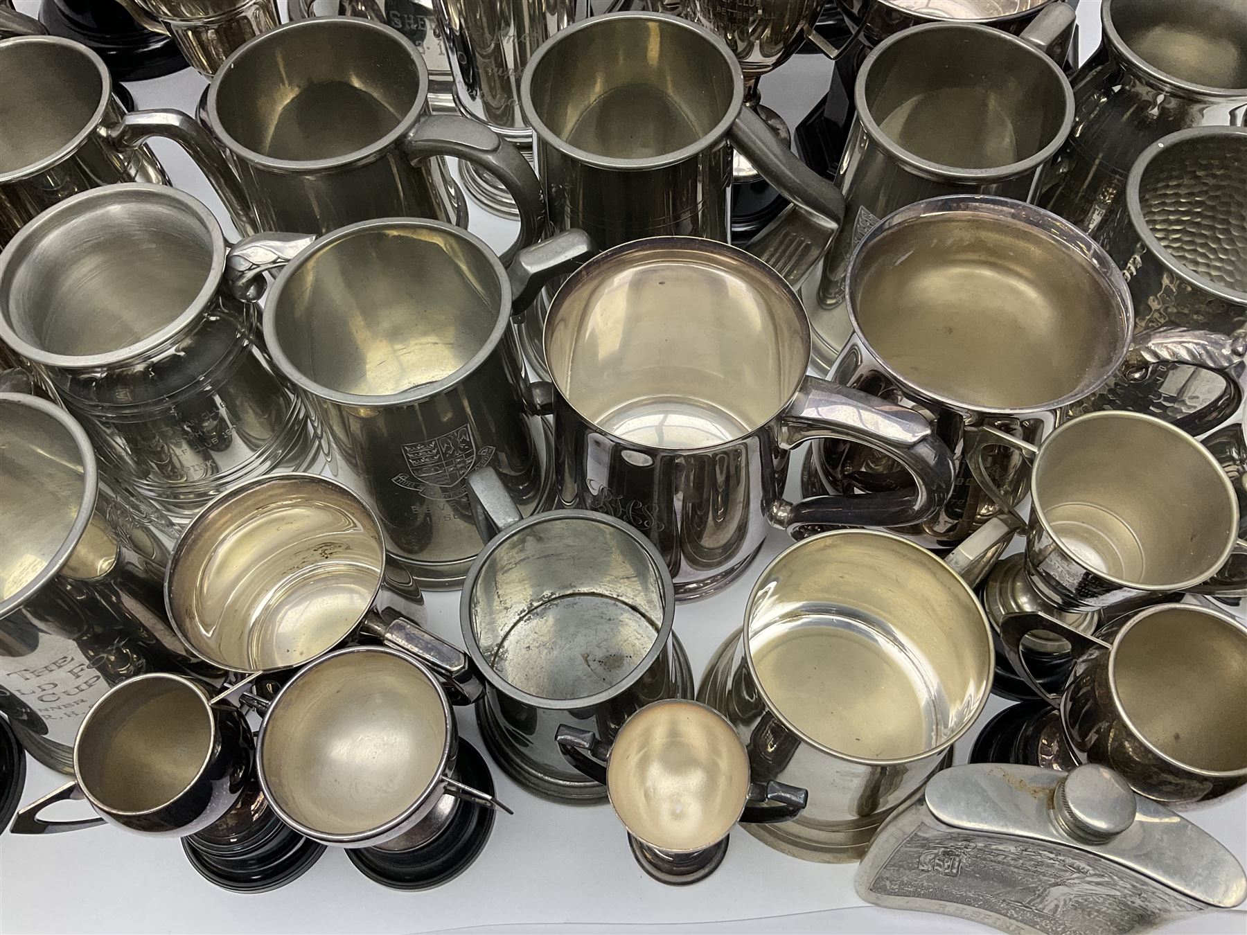Collection of pewter and silver-plated trophy cups and presentation tankards, largest H28cm
