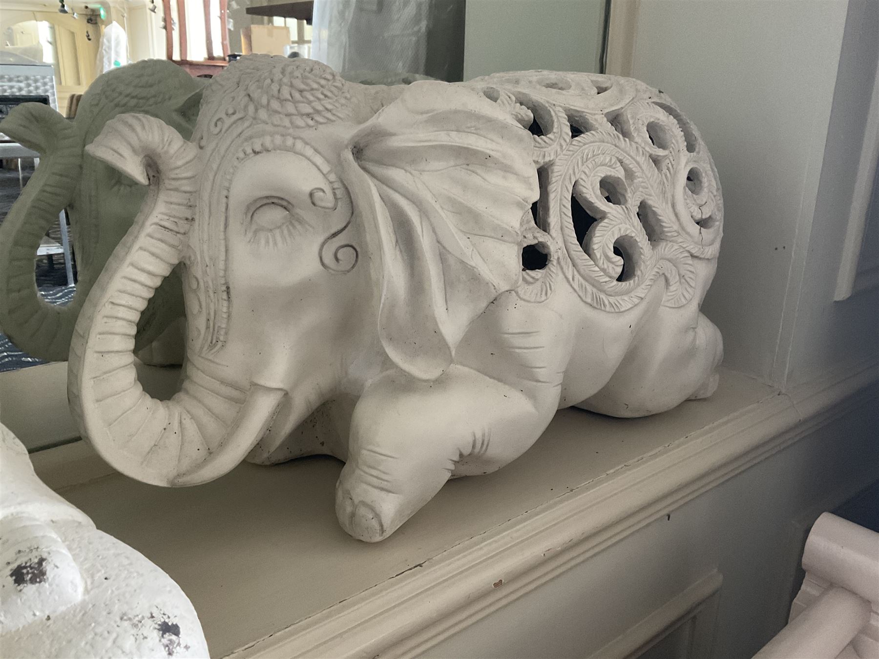 Three cast seated Buddhas and an elephant (4)- LOT SUBJECT TO VAT ON THE HAMMER PRICE - To be collected by appointment from The Ambassador Hotel, 36-38 Esplanade, Scarborough YO11 2AY. ALL GOODS MUST BE REMOVED BY WEDNESDAY 15TH JUNE.