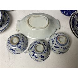 20th century Oriental blue and white ceramics, to include three ginger jars and one urn with cover, all decorated with prunus blossom on a blue ground, each with printed concentric circles mark beneath, together with a collection of similar Oriental blue and white ceramics, tallest H16.5cm