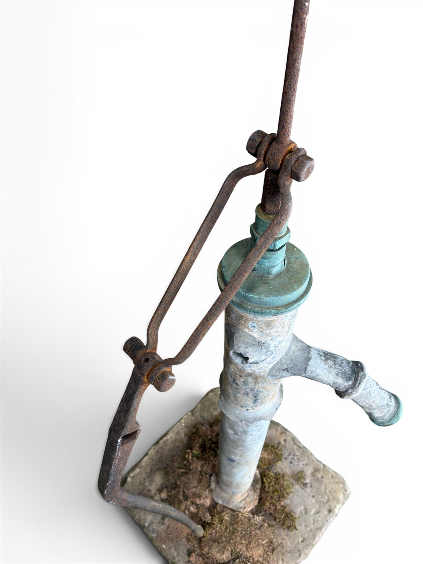 Georgian period lead garden water pump, with iron handle, set in square stone base