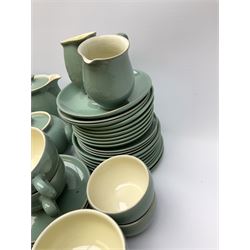 Denby Manor Green pattern tea service, comprising of three teapots, twelve coffee pots of various sizes, four hot water jugs with lids, seven jugs, eleven teacups, four mugs, seventeen saucers, six sugar bowls, two sugar bowls with lids and eleven side plates.  