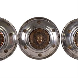 Three wall hanging shields the central panel decorated in relief with Medusa, D56cm 