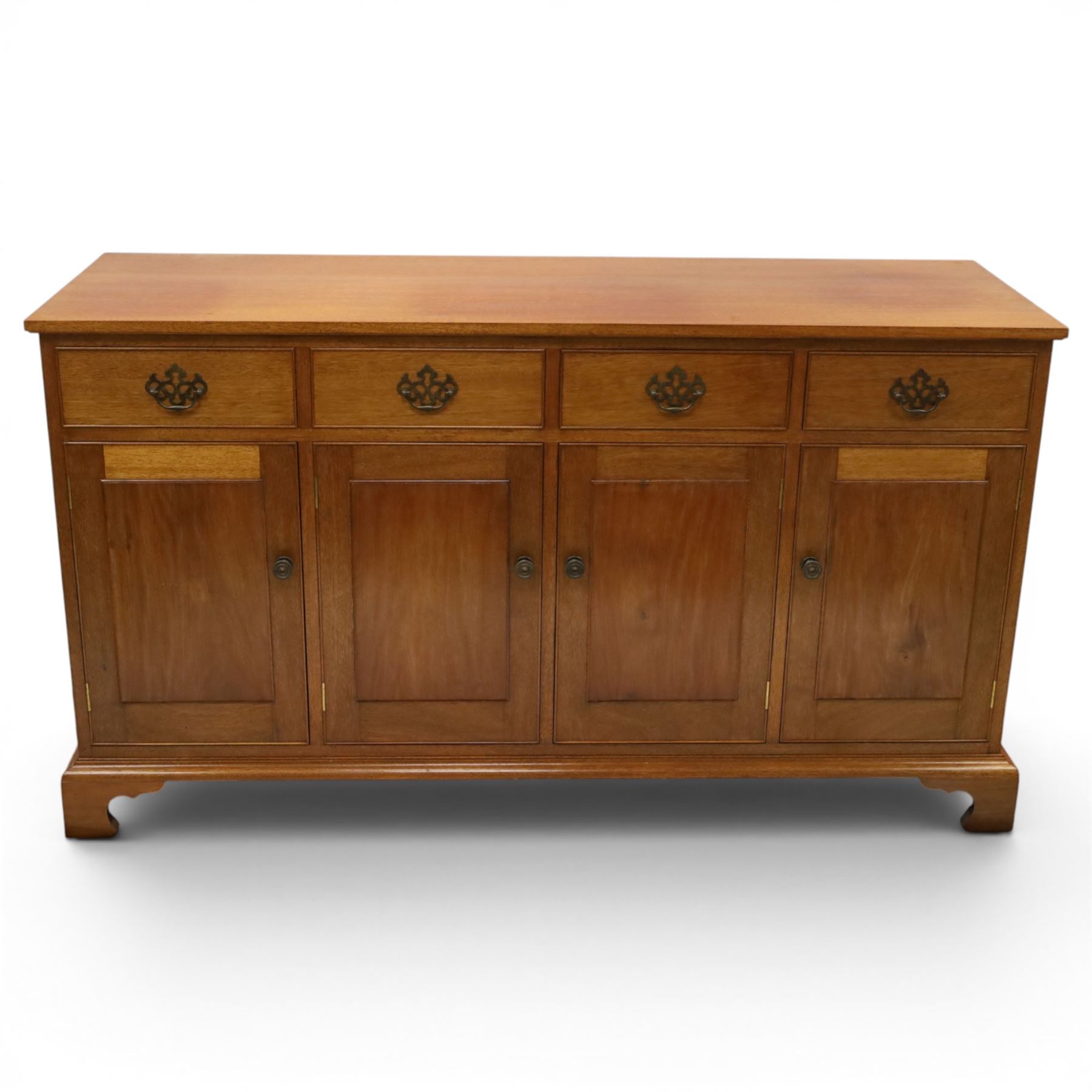 Acornman - mahogany sideboard, rectangular top over four drawers and four panelled cupboard doors with brass handles, on bracket feet, with signature carved acorn, by the workshop of Alan Grainger of Brandsby