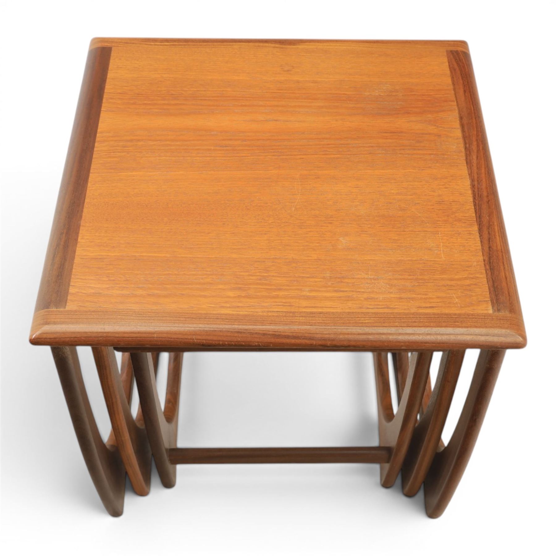 G-Plan - 'Astro' teak nest of three tables, square top with shaped supports
