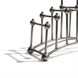 Christopher Dresser (1834-1904) for Hukin & Heath, silver plated six division bridge toast rack, circa 1880, Stamped makers marks and model number 2554, H12cm
