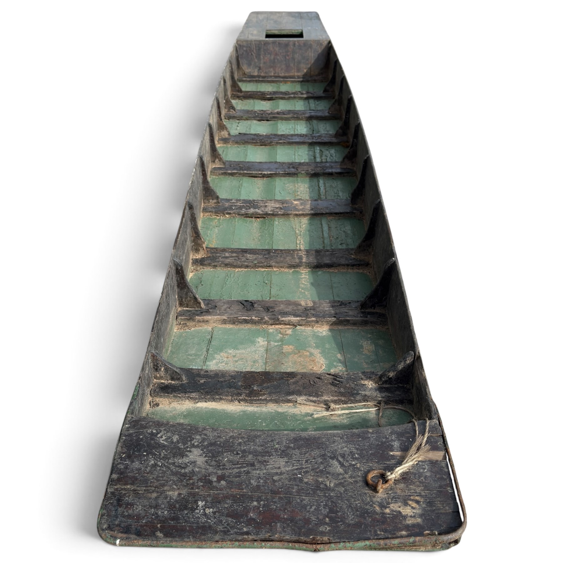 Large early 20th century plank-built wooden river punt, the long tapering hull with enclosed fore and aft decks, open green-painted ribbed interior, together with two paddles