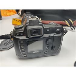 Four camera bodies, to include, Ricoh KR-10 serial no. 38826, Pentax MZ-M serial no. 4185969 with 'SMC Pentax- M 1:3.5 28mm' lens, Canon EOS500 serial no. 080927, with 'Sigma Zoom 100-300mm 1:4.5-6.7 DL'  lens etc, with other camera lenses and equipment 