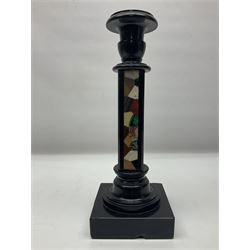 Black stone column candlestick, with mineral specimens upon two sides, H30cm