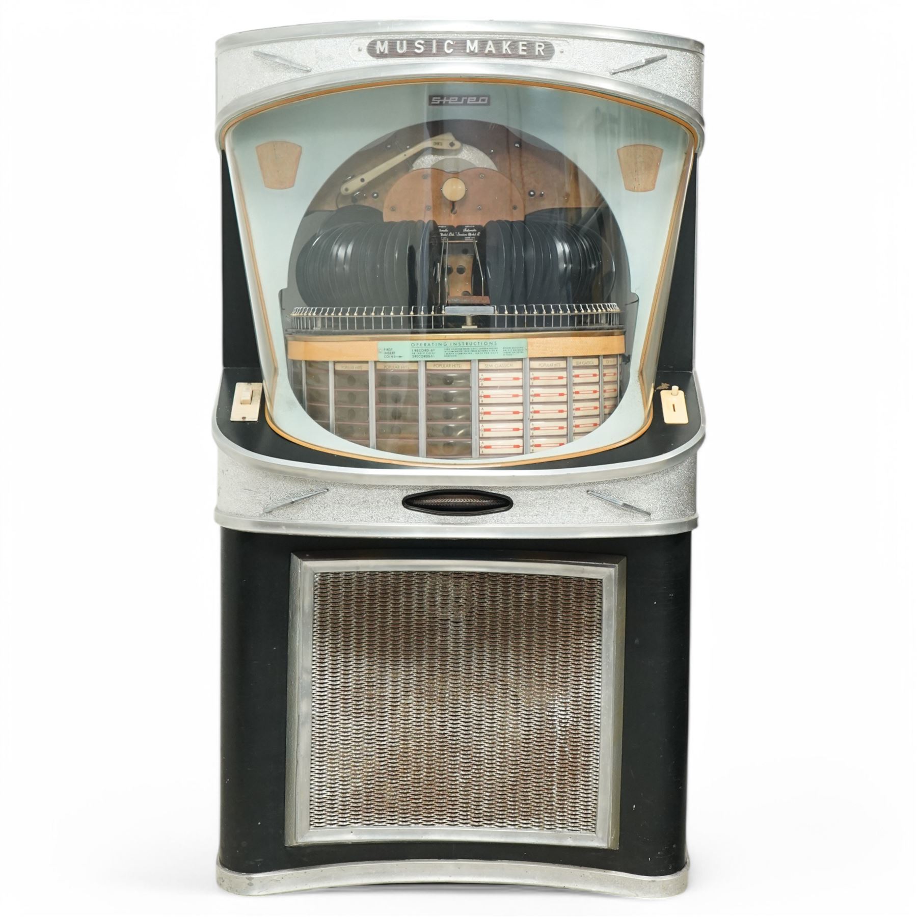 Ditchburn - 'Music Maker Panoramic 200' jukebox circa 1959, curved panoramic glazed front offering full view of the automatic selection process, accommodating 100 records (200 selections), with a stereo sound system, the aluminium trim over a woven speaker grille with an all-over ebonised and silver finish