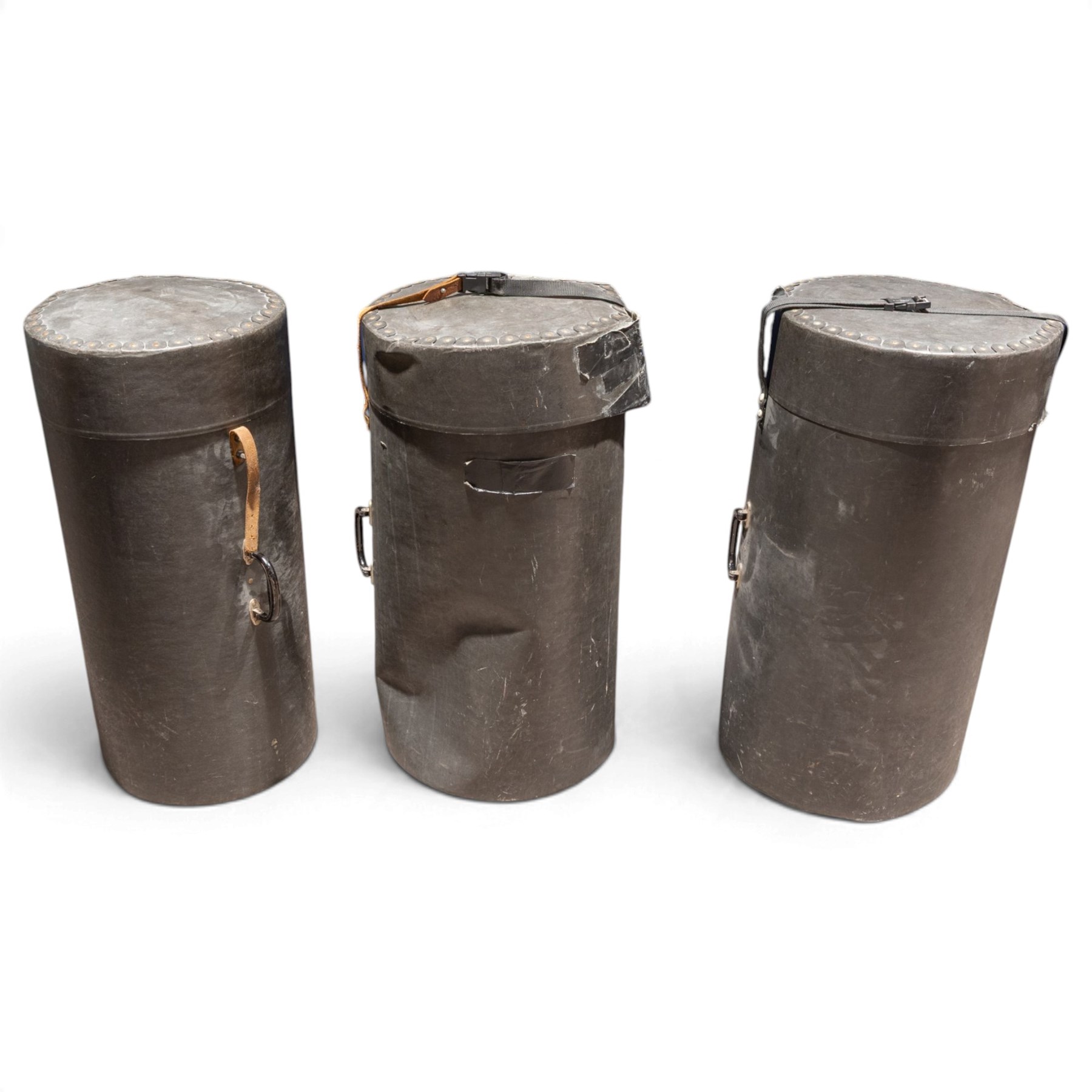 Three conga drums, comprising two Excelsior A. Salvadori Firenze stave-built wooden congas and one similar French example, with skin heads and metal tension mounts, on metal stands with hard carry cases for drums, tallest H79cm, D31cm
