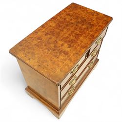 Late 20th century figured walnut miniature chest, the rectangular top with feather banded border over two short and two long drawers, fitted with brass batwing handles, upon moulded plinth base and four bracket feet, H60cm, w67cm, D36cm