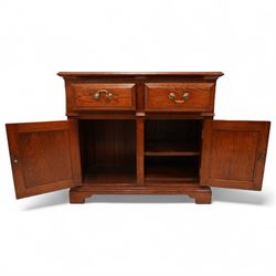 20th century country oak side cabinet, rectangular top over two short drawers and twin panelled cupboard doors, flanked by reeded uprights, on plinth base