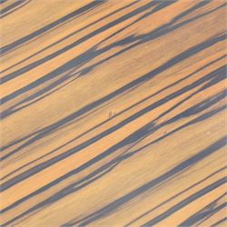 Toby Winteringham - Mid 20th century zebra wood coffee table, oval top with book matched striped veneers over two open tiers painted red, the curved end supports and continuous plinth base veneered to match, recessed plinth base 