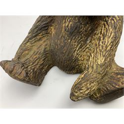 19th century cast iron door stop, modelled as a seated toy bear, with remnants of painted finish, H22.5cm