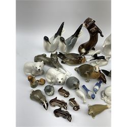 A collection of Russian animal figures, largely comprising Lomonosov examples, to include examples modelled as otters, seals, polar bears, horse, various birds, wolf, hedgehog, etc. 