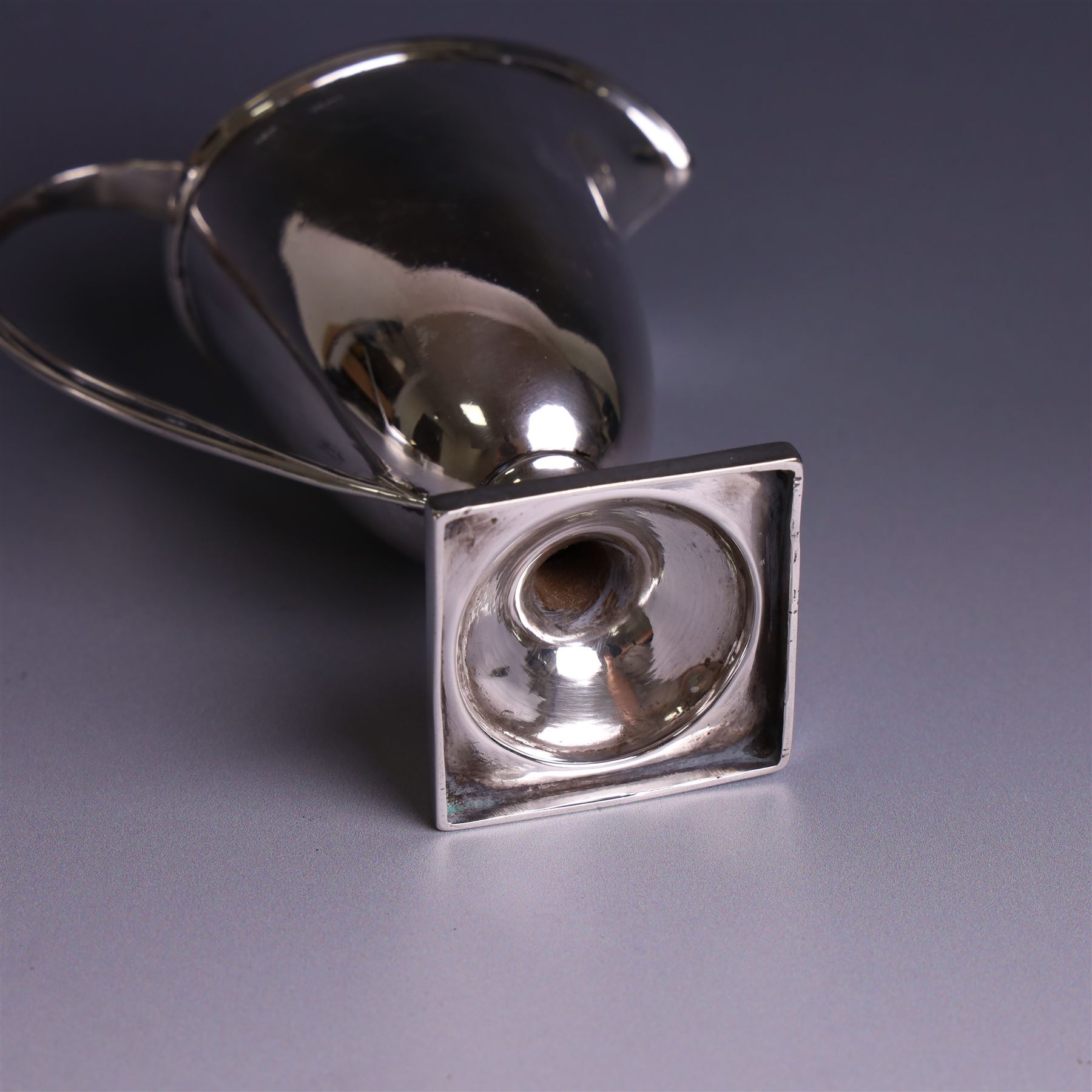Edwardian silver helmet shaped cream jug, with plain bowl and upon a square base, hallmarked D & M Davis , Chester 1901, H13cm