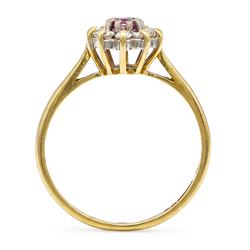 18ct gold pink sapphire and diamond cluster ring, single oval cut sapphire of 0.23 carat, surrounded by ten round brilliant cut diamonds, Birmingham 1985, total diamond weight 0.26 carat