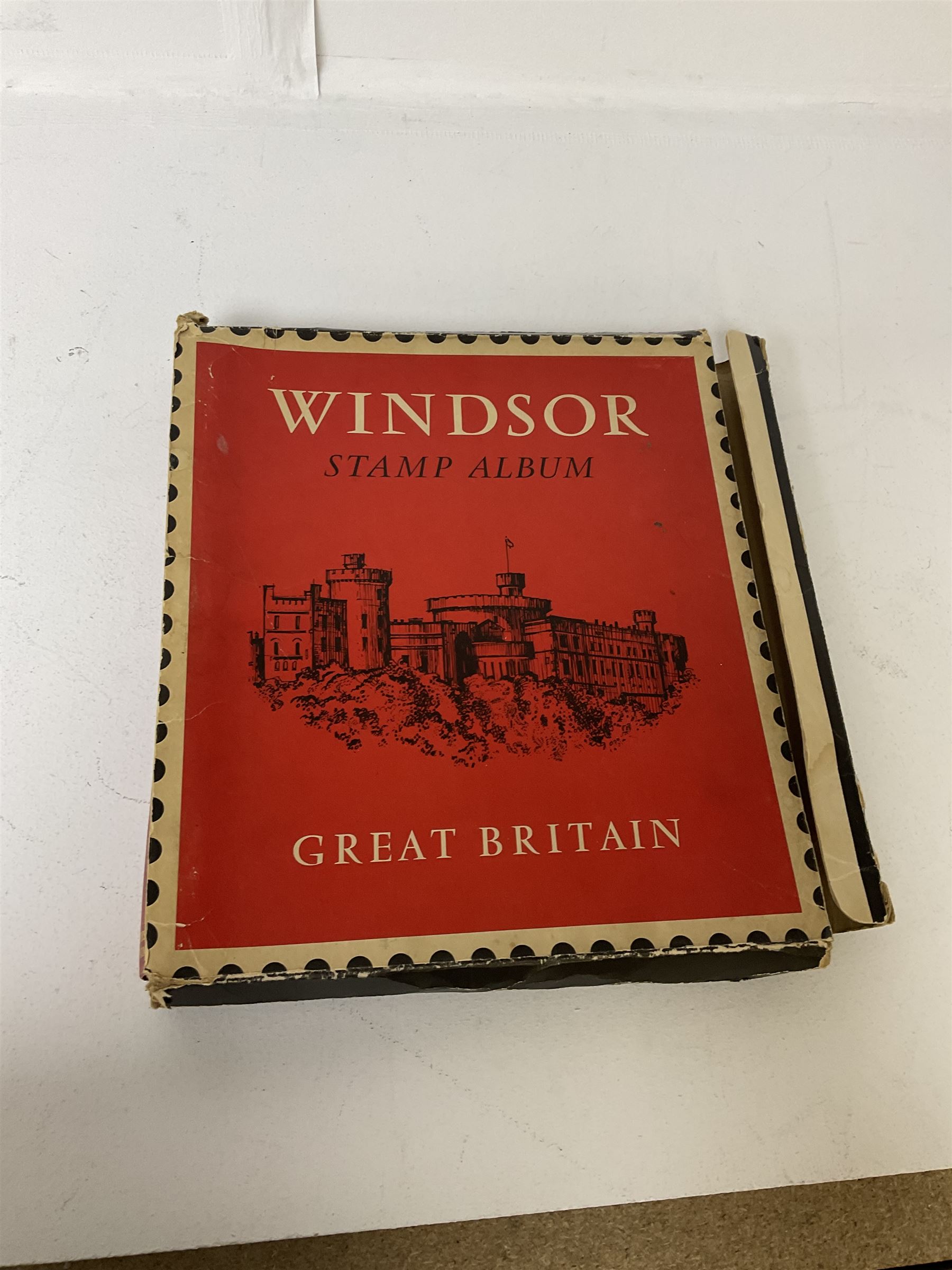 Queen Victoria and later Great British stamps housed in a red 'Windsor' album, including penny reds etc