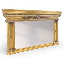 Early 20th century gilt over mantel mirror, the rectangular plate within stepped and moulded frame with central applied foliate ornament and fluted side uprights