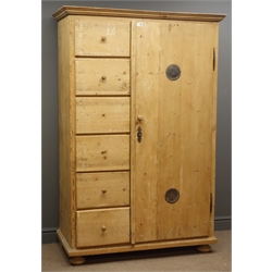  19th century French pine farmhouse larder cupboard, projecting cornice, six drawers, alongside full length cupboard with two circular vents, enclosing four shelves, on bun feet, W117cm, H176cm, D56cm  